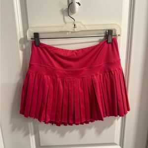 Hot pink gold hinge athletic skirt.